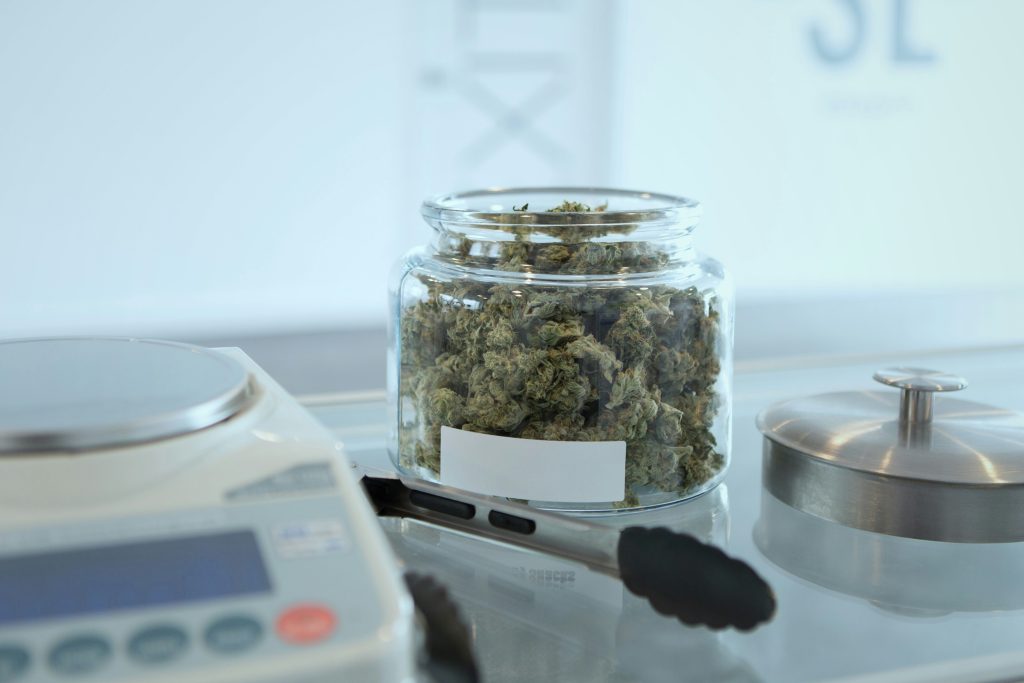 cannabis buds in a clear glass jar